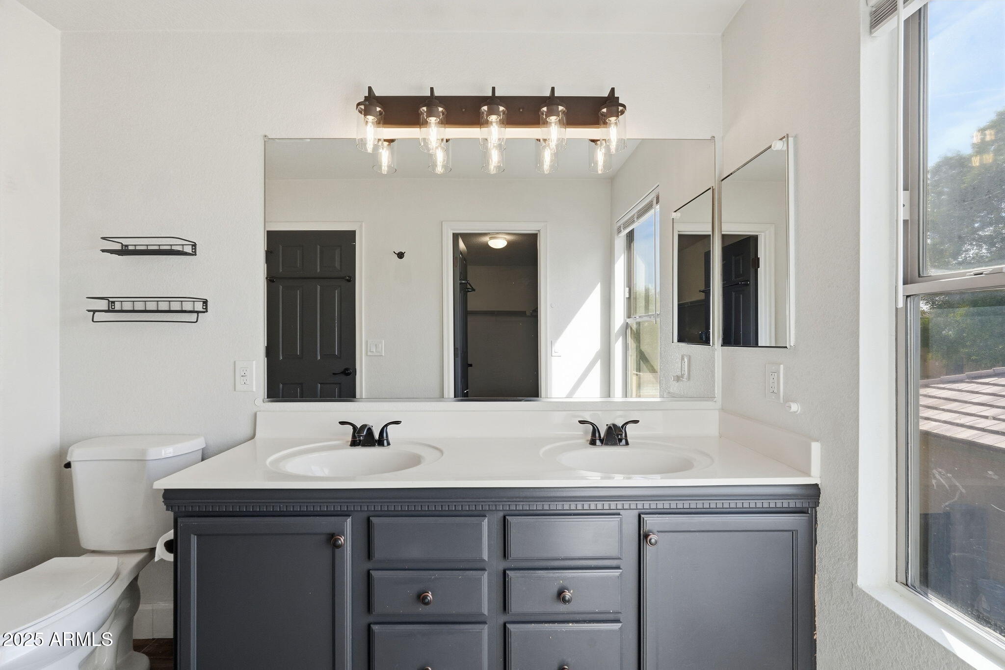 544 West Aviary Way Gilbert, AZ 85233 - Photo 31 of 45 a bathroom with a sink and a mirror