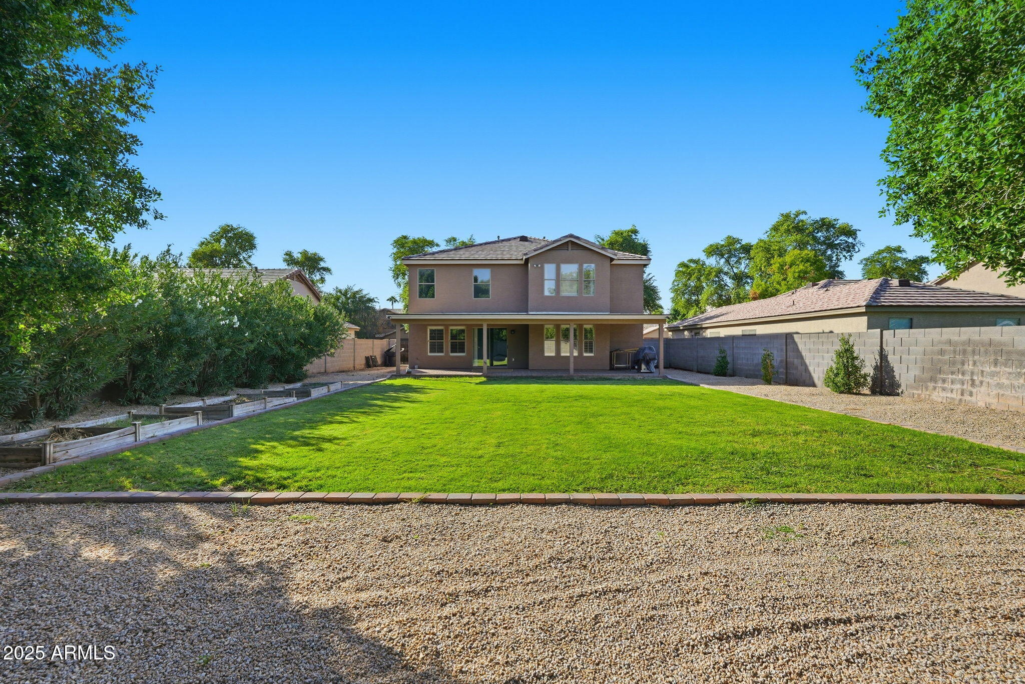 544 West Aviary Way Gilbert, AZ 85233 - Photo 36 of 45 a front view of a house with a yard and garage