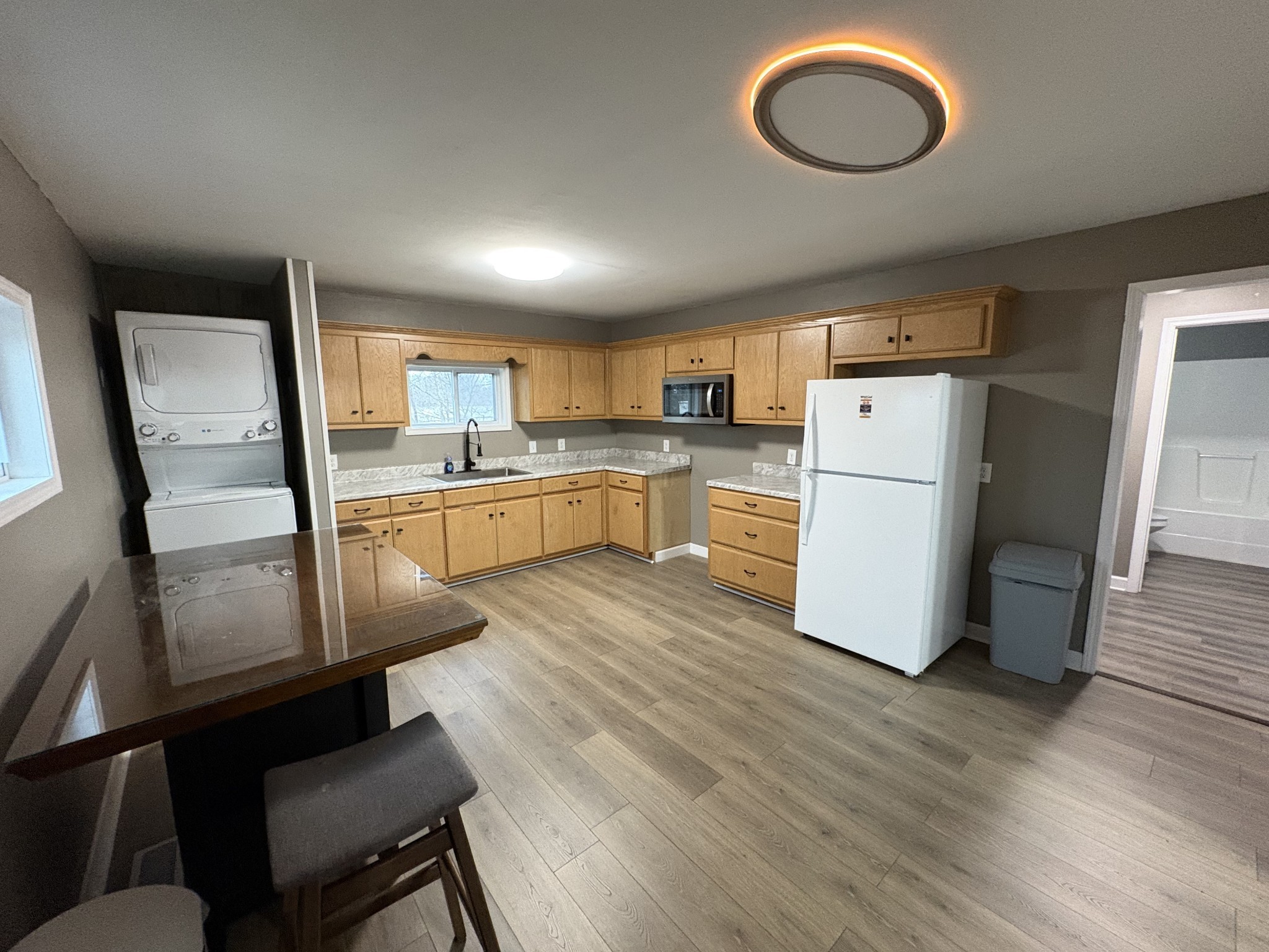 134 Elm Street Pulaski, TN 38478 - Photo 11 of 34 a kitchen with refrigerator cabinets and wooden floor