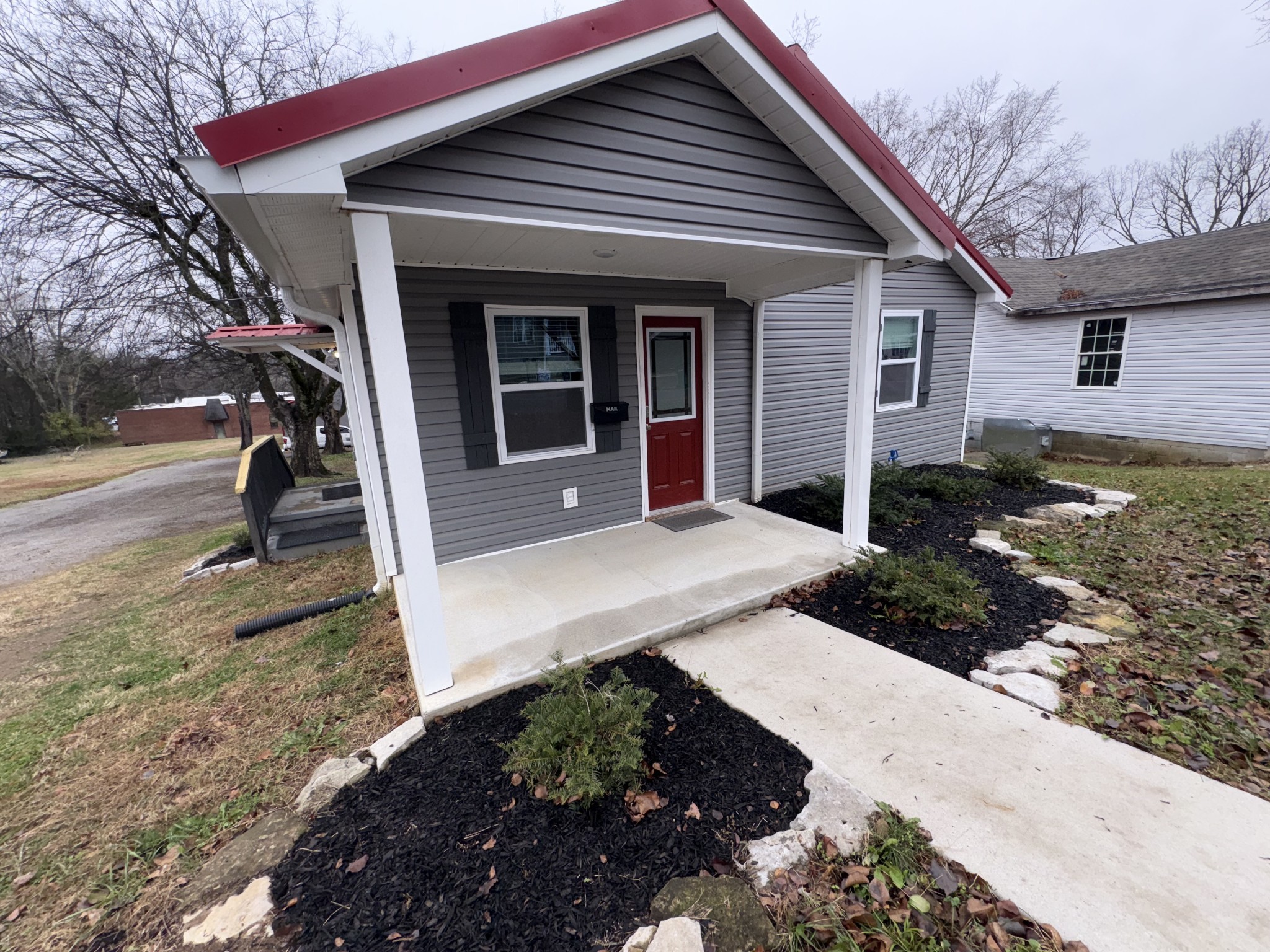 134 Elm Street Pulaski, TN 38478 - Photo 2 of 34 a front view of a house with garden