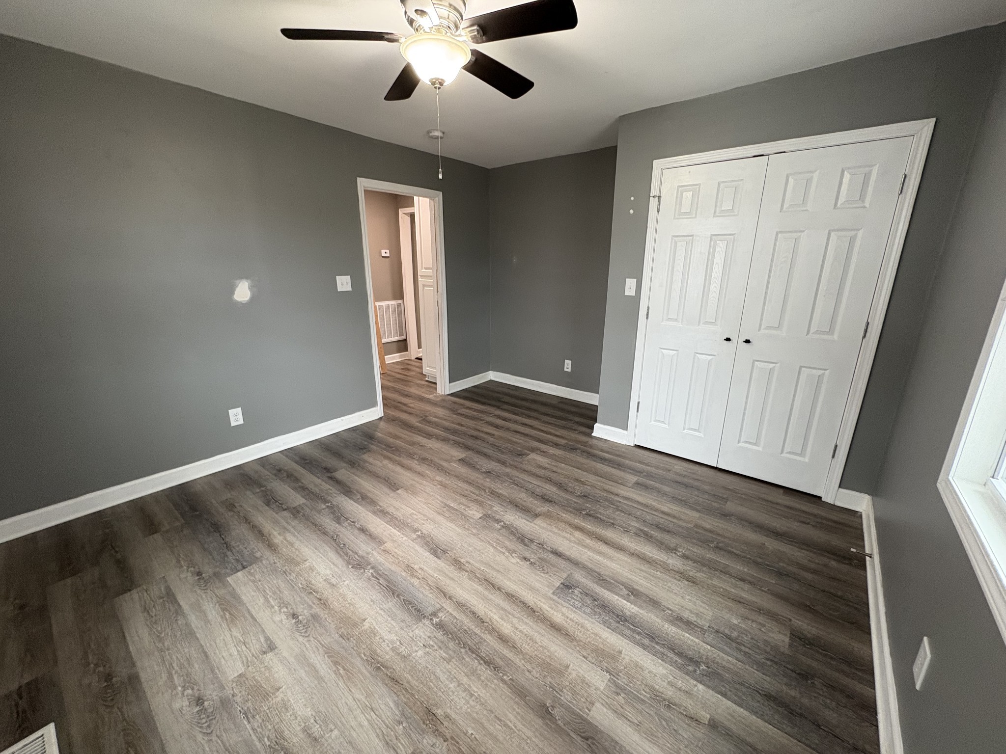 134 Elm Street Pulaski, TN 38478 - Photo 22 of 34 wooden floor in an empty room with a window