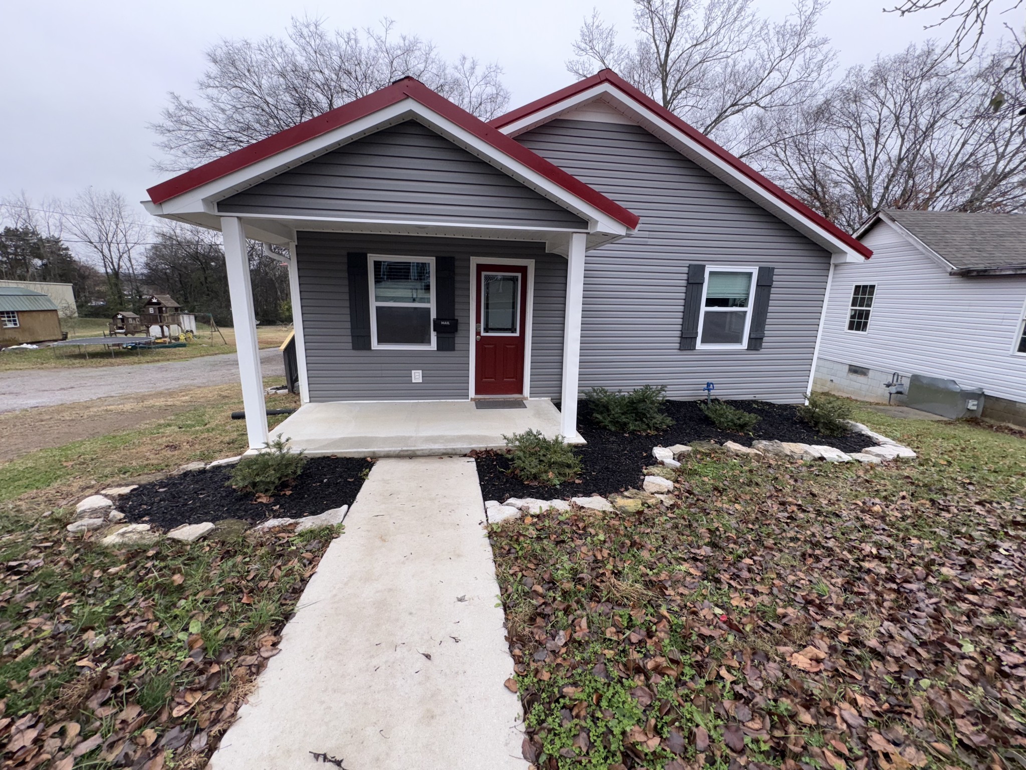 134 Elm Street Pulaski, TN 38478 - Photo 4 of 34 a front view of a house with a yard