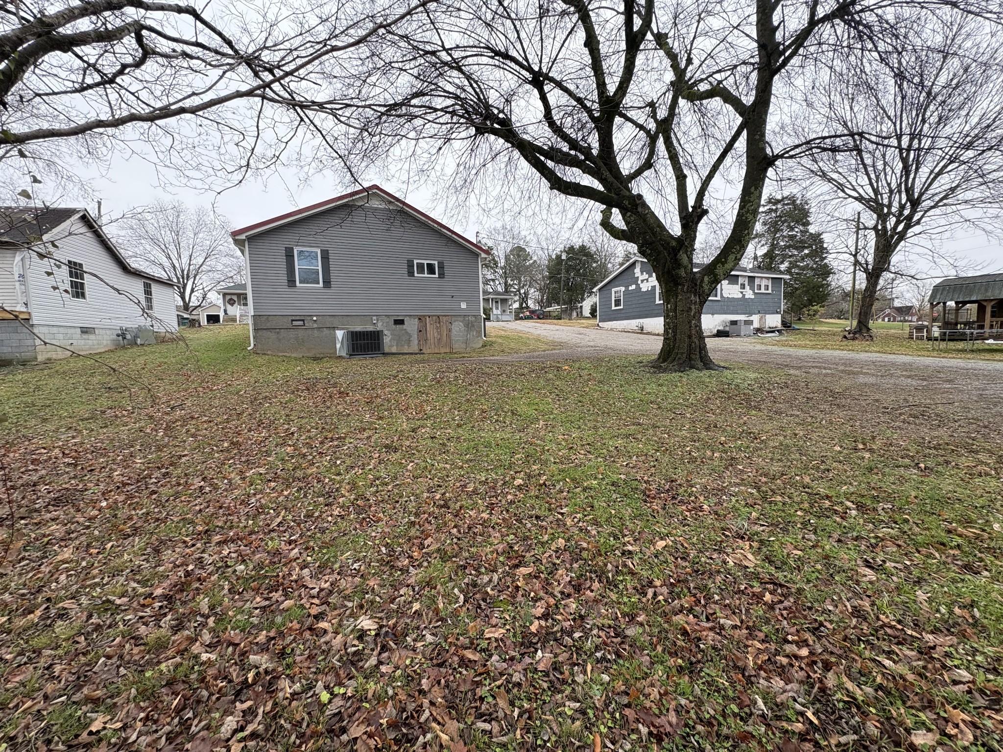 134 Elm Street Pulaski, TN 38478 - Photo 6 of 34 a house with trees in front of it