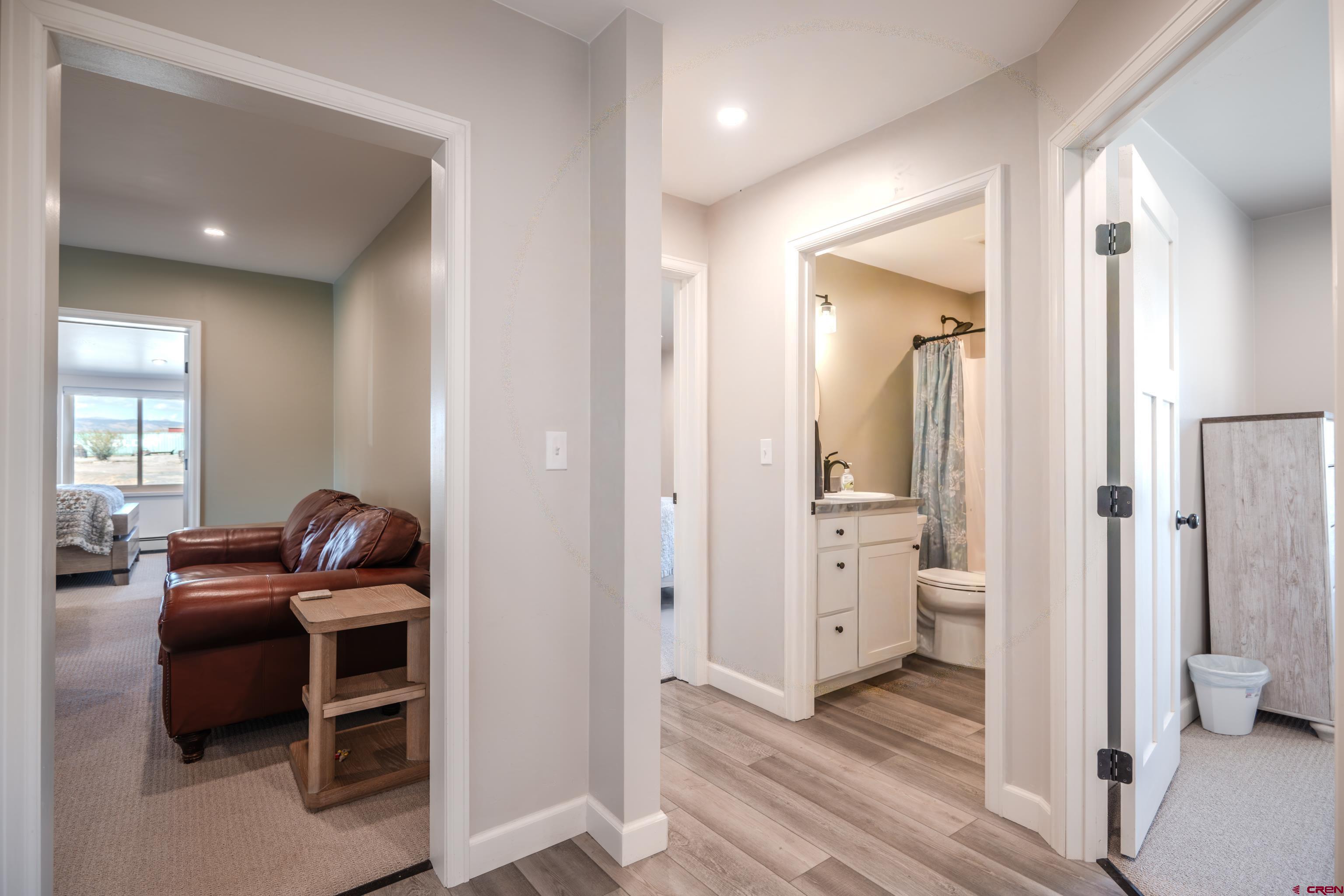 43950 Highway 50 Gunnison, CO 81230 - Photo 11 of 45 a view of a hallway with bathroom and wooden floor