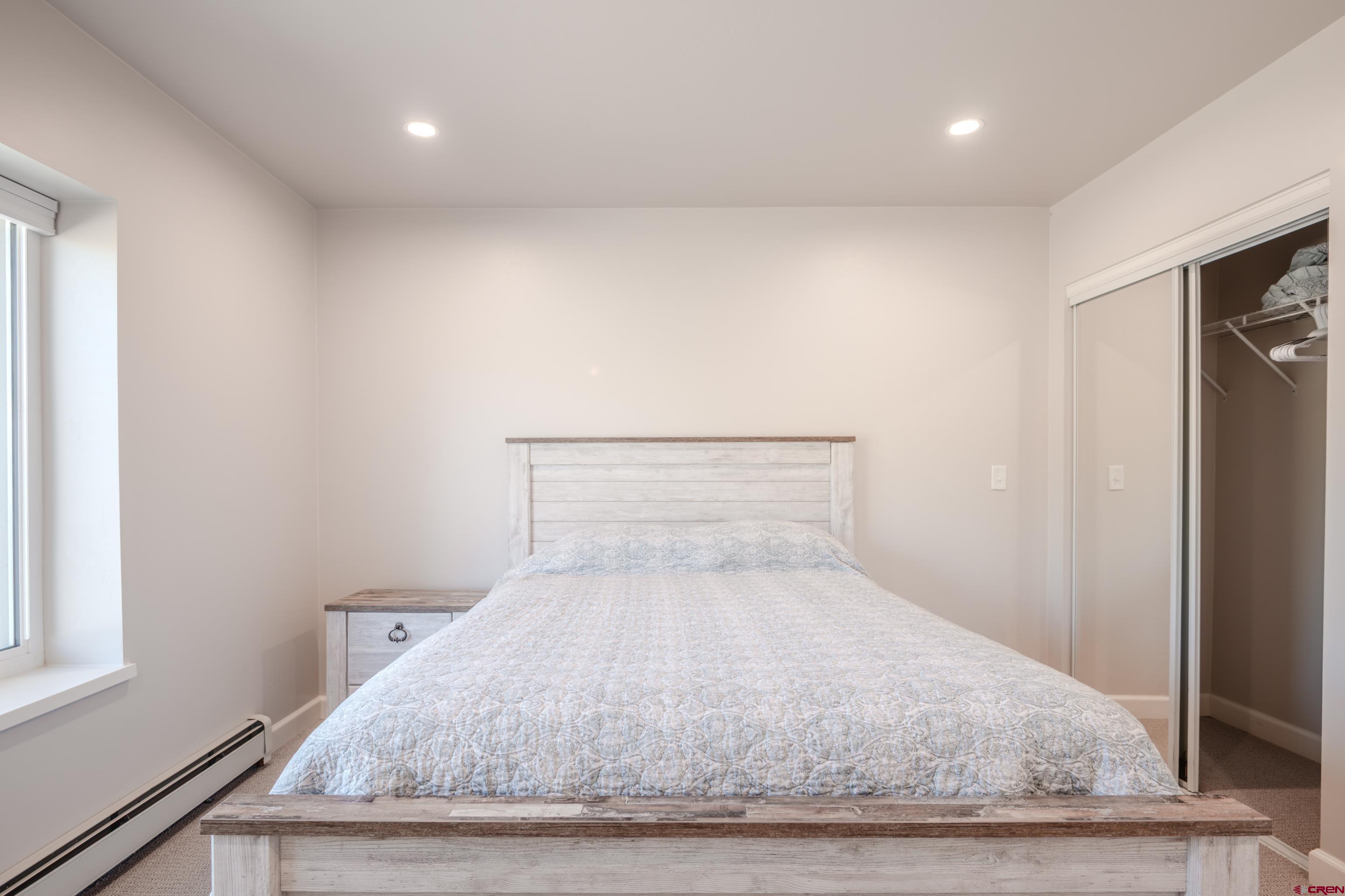 43950 Highway 50 Gunnison, CO 81230 - Photo 21 of 45 a bedroom with a bed and a window