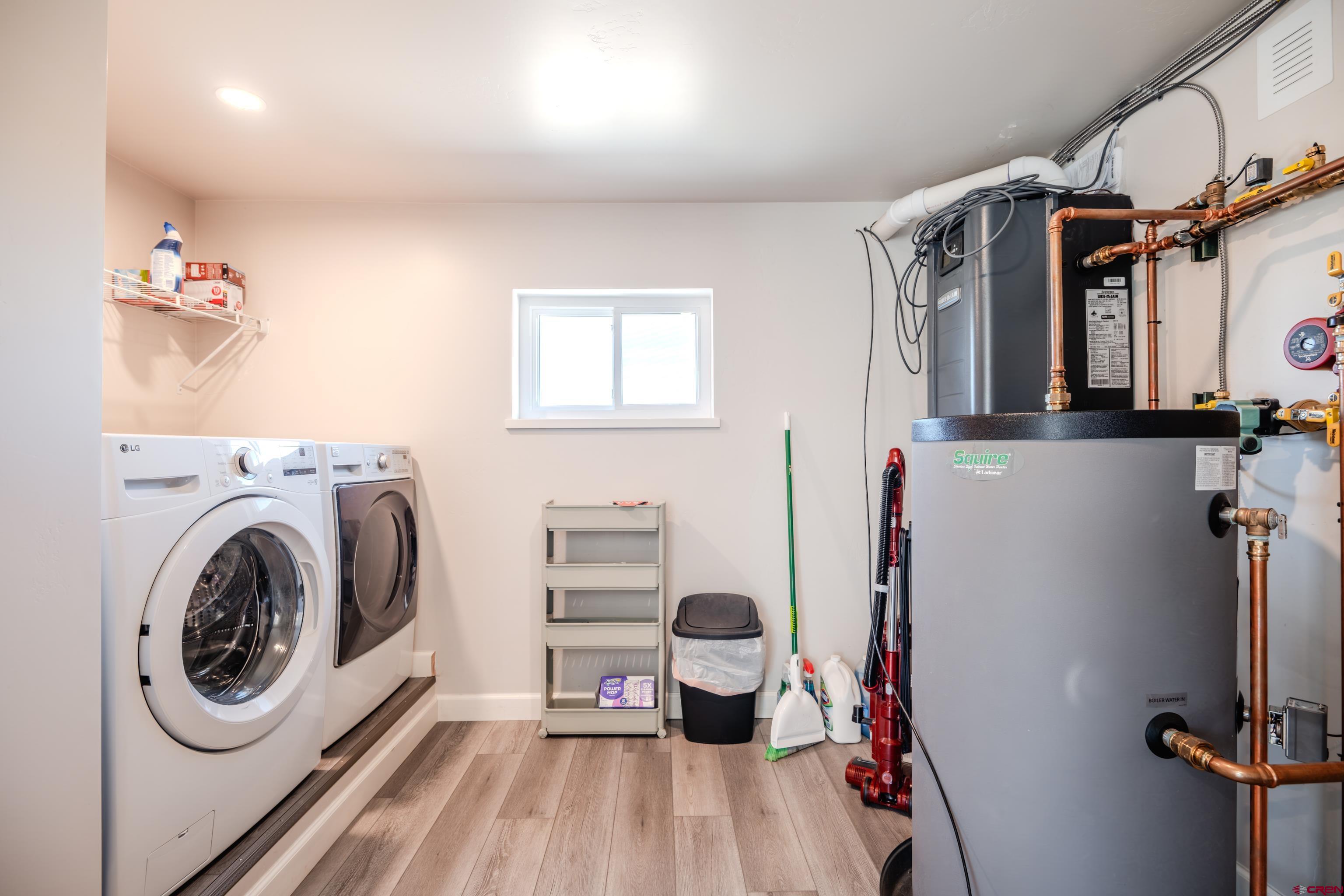 43950 Highway 50 Gunnison, CO 81230 - Photo 30 of 45 a utility room with sink dryer and washer