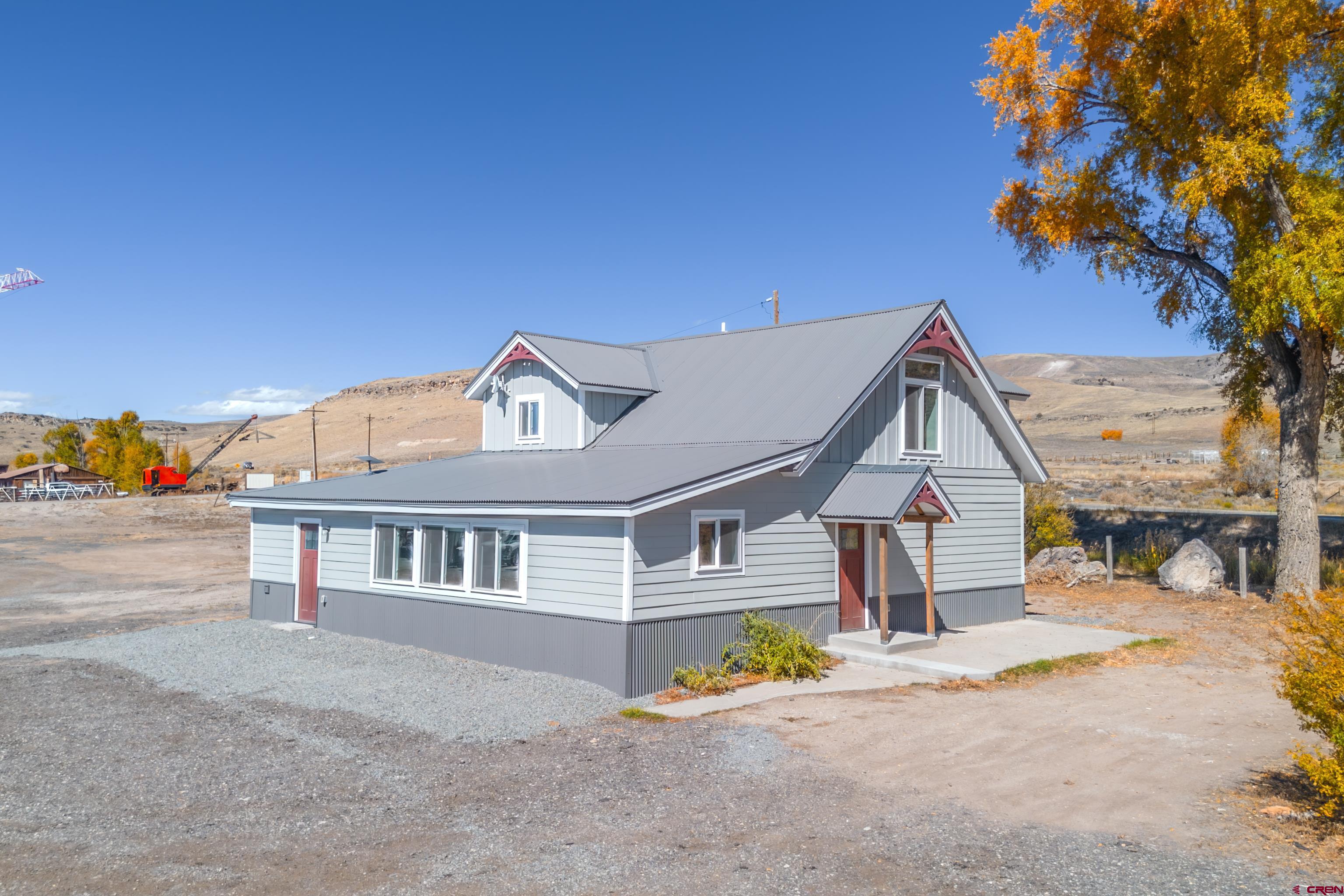 43950 Highway 50 Gunnison, CO 81230 - Photo 32 of 45 a front view of a house with a yard