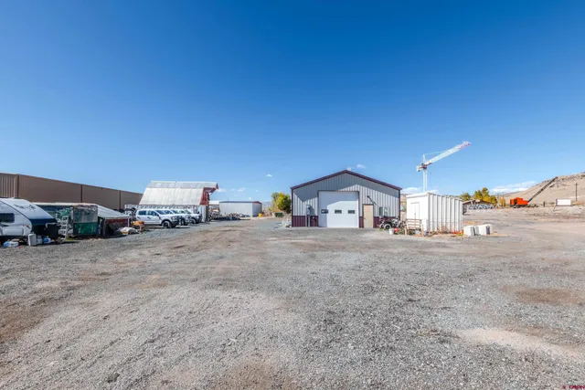 a view of a house with a cars park