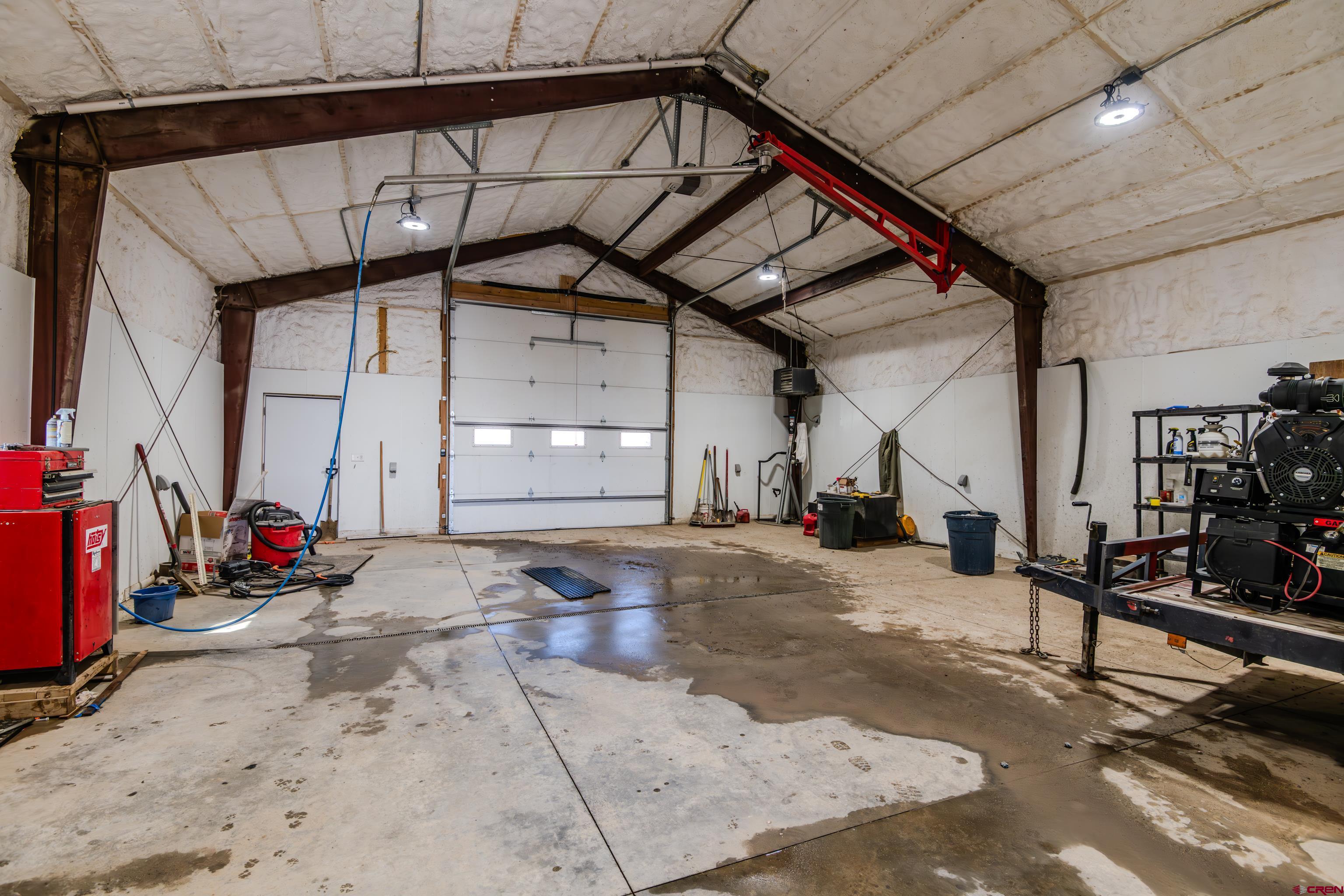 43950 Highway 50 Gunnison, CO 81230 - Photo 41 of 45 a view of a garage with wooden floor and some chairs