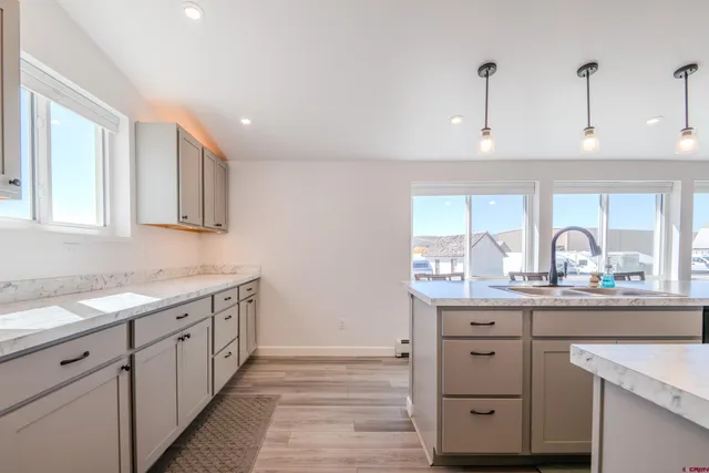 a kitchen with a sink and cabinets