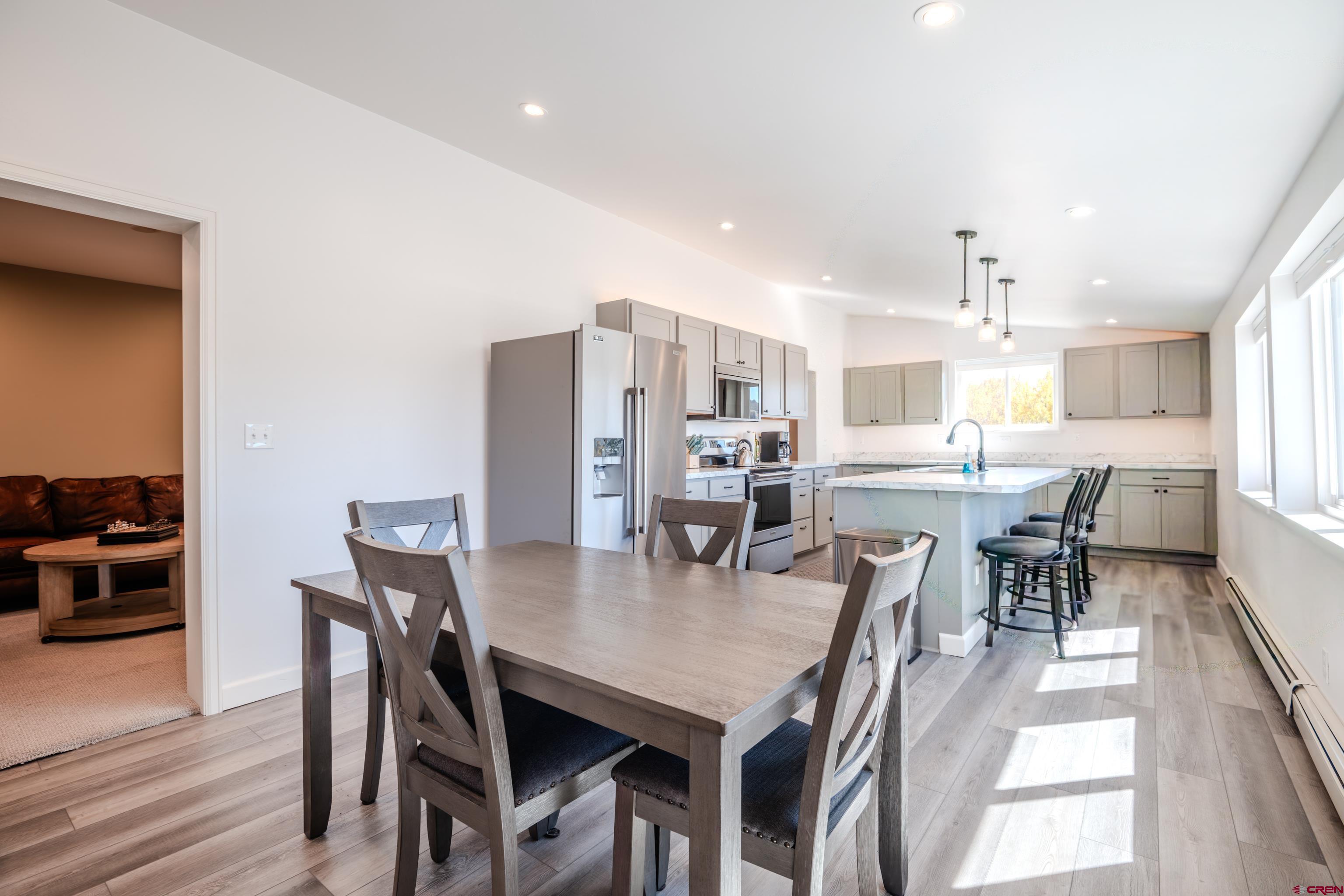 43950 Highway 50 Gunnison, CO 81230 - Photo 10 of 45 a view of a dining room with furniture and wooden floor