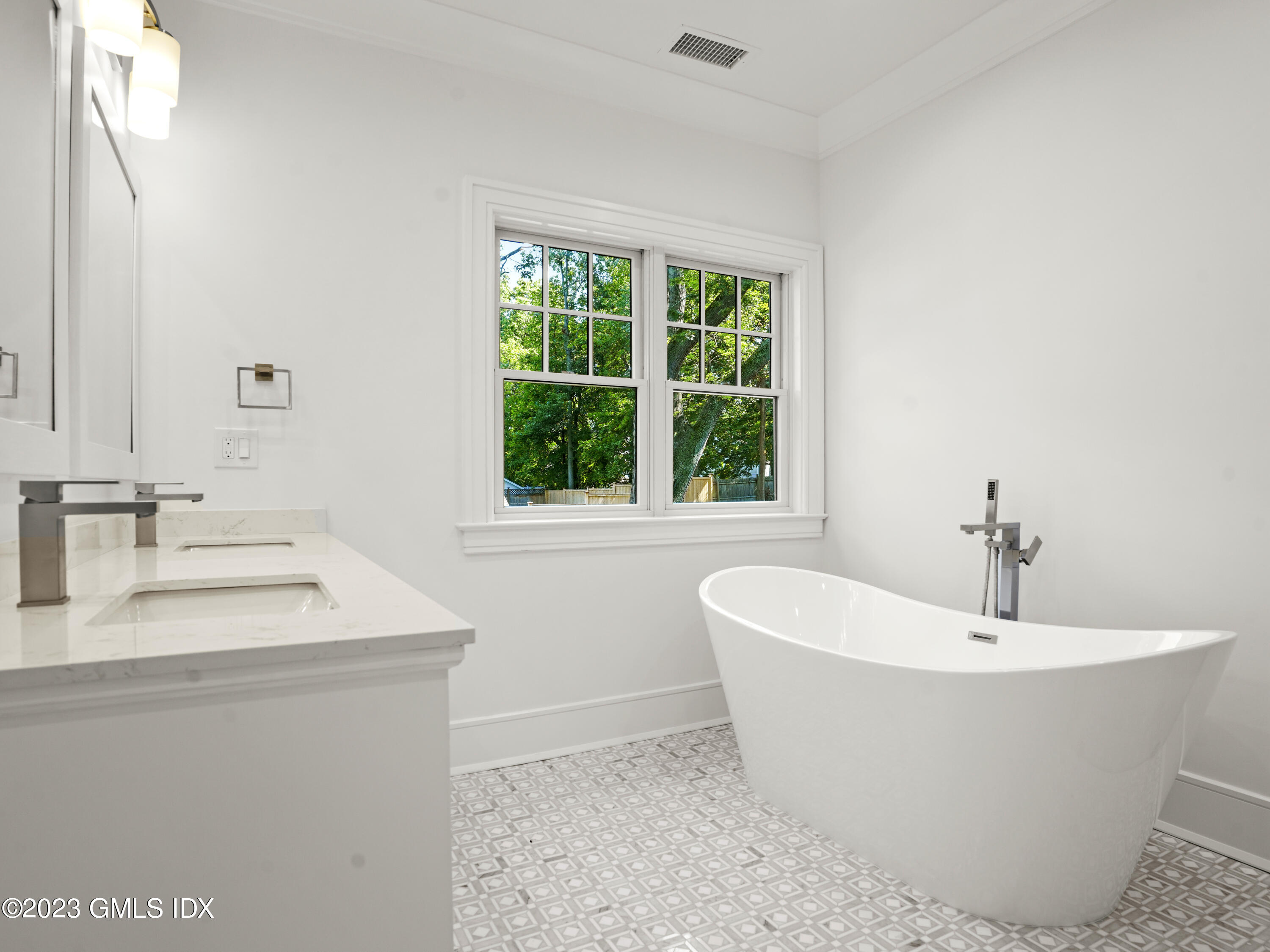 40 Butler Street Cos Cob, CT 06807 - Photo 19 of 27 a white bath tub sitting in a bathroom
