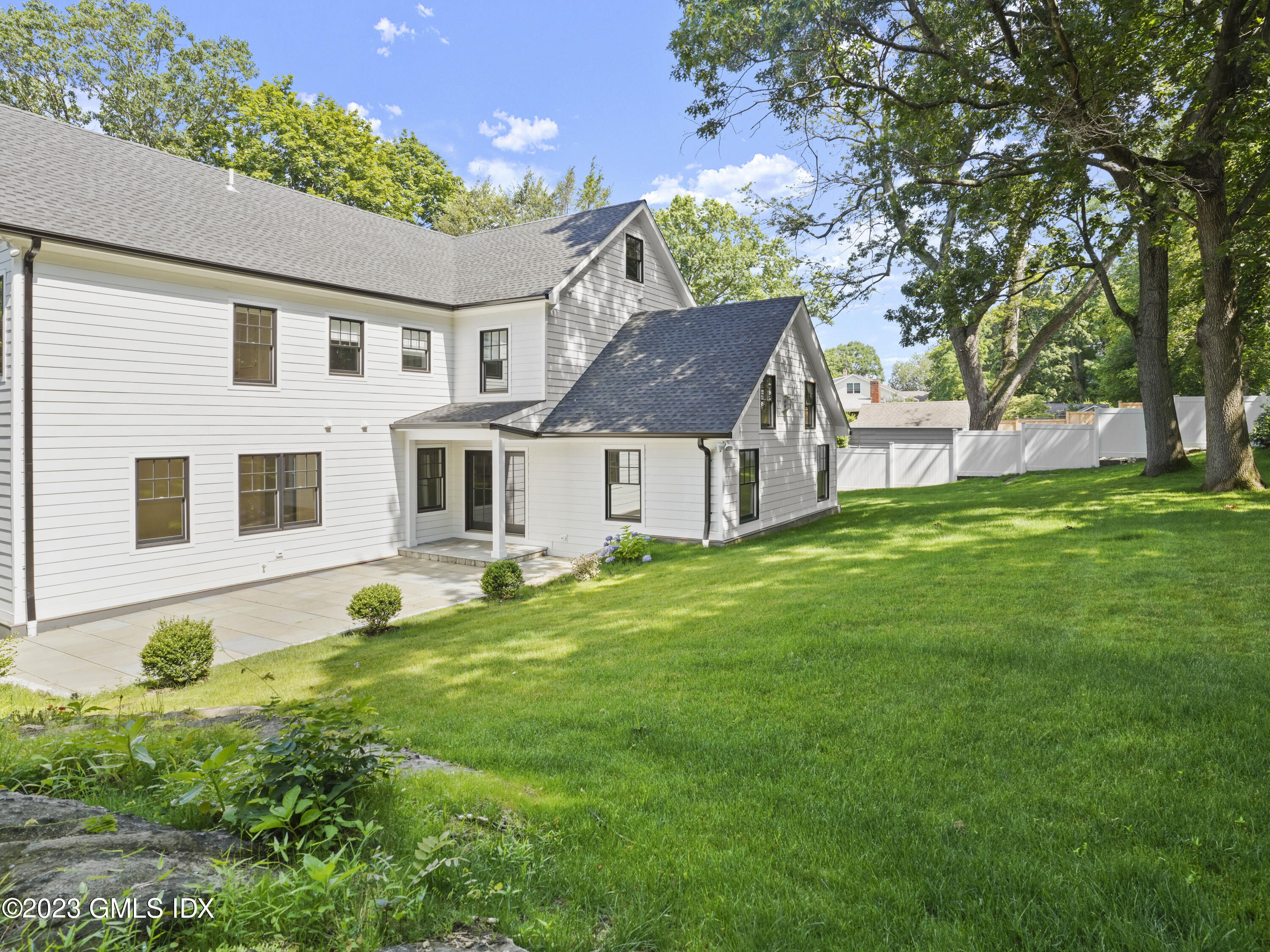 40 Butler Street Cos Cob, CT 06807 - Photo 27 of 27 a view of a yard in front of a house with large tree