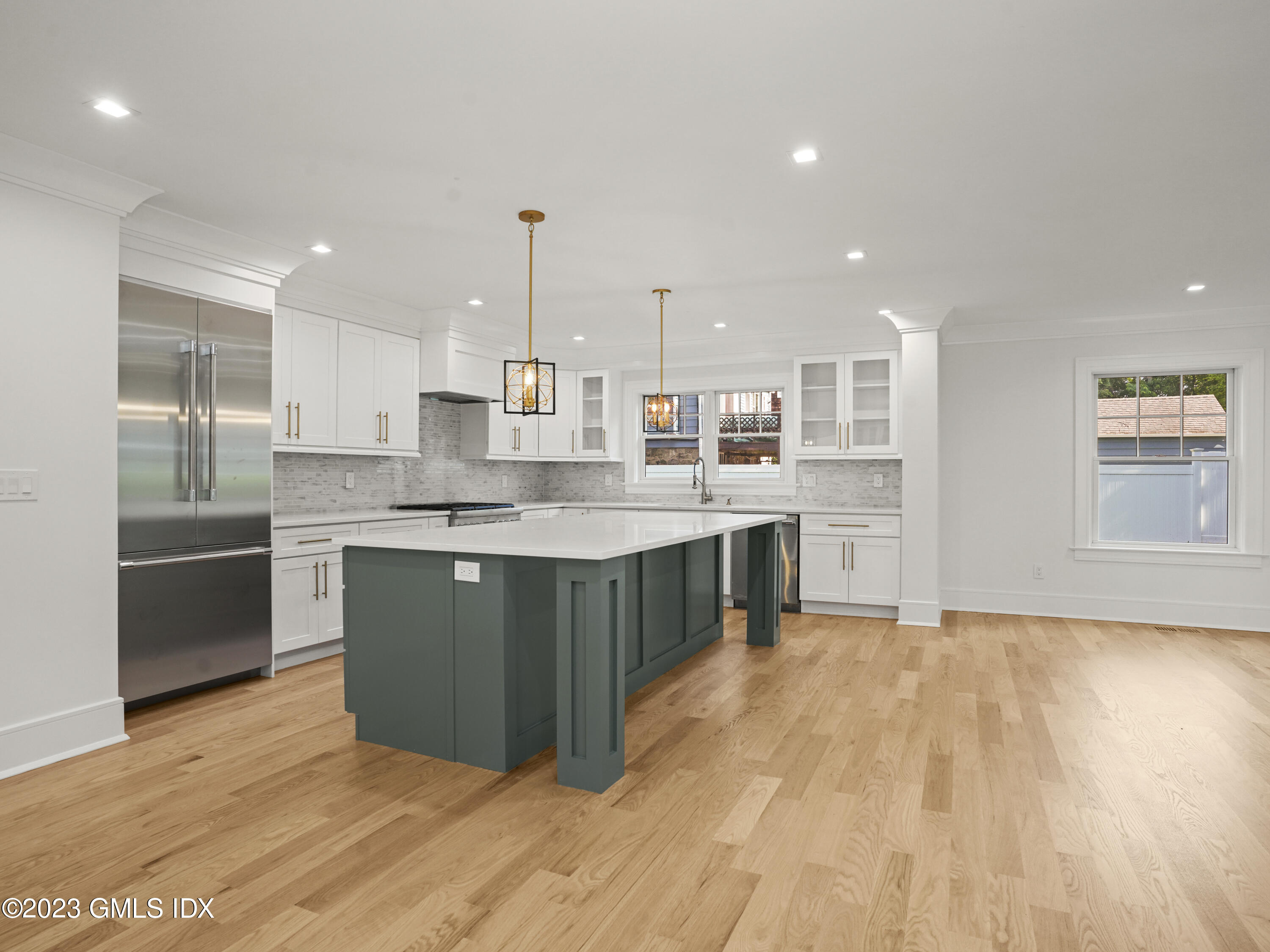 40 Butler Street Cos Cob, CT 06807 - Photo 4 of 27 a kitchen with stainless steel appliances granite countertop a stove a sink and a refrigerator