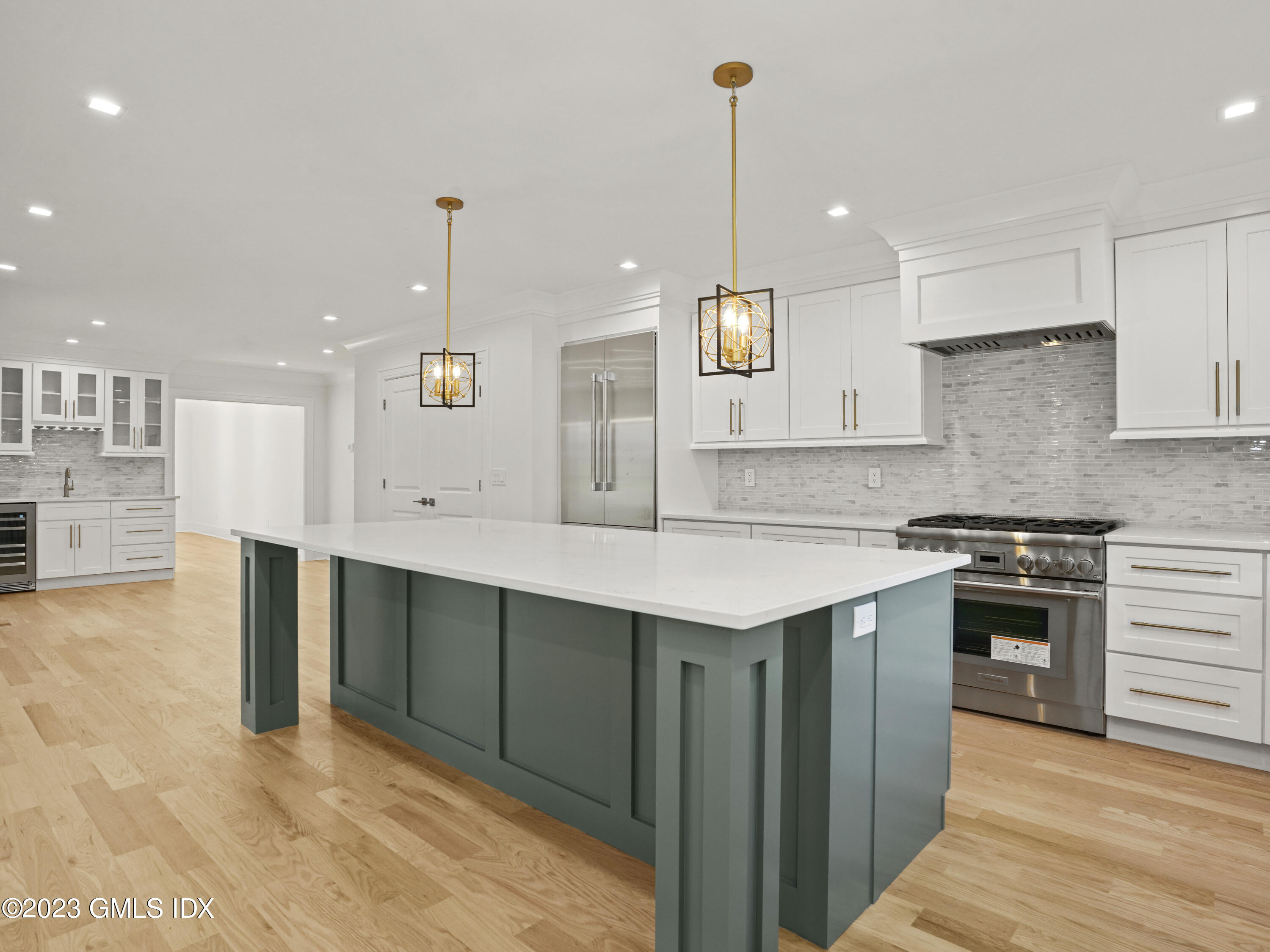 40 Butler Street Cos Cob, CT 06807 - Photo 5 of 27 a kitchen with kitchen island a sink stainless steel appliances and cabinets