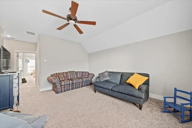 a living room with furniture and a rug