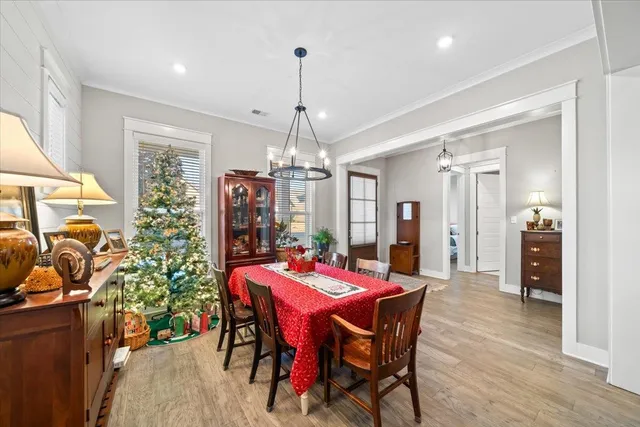 a dining room with furniture and window