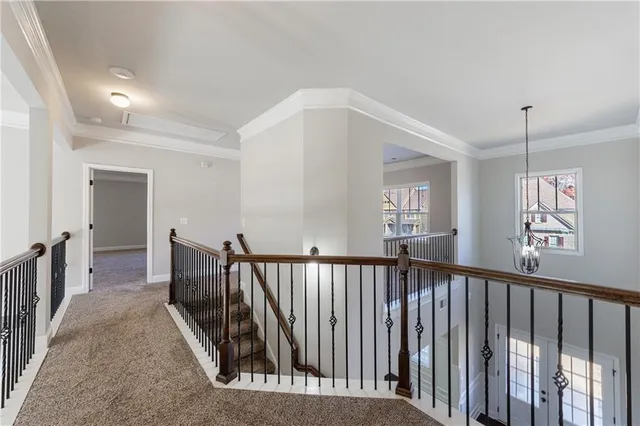 a bathroom with a granite countertop double vanity sink and a mirror