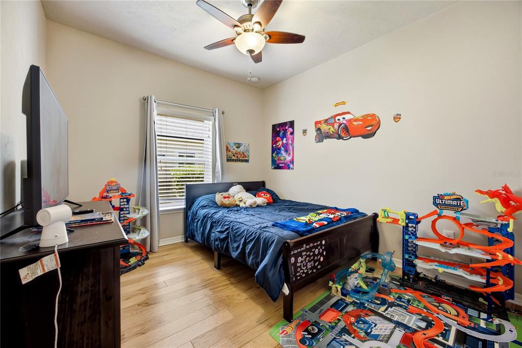 7550 Southwest 81st Way Gainesville, FL 32608 - Photo 23 of 31 a bedroom with bed and a window