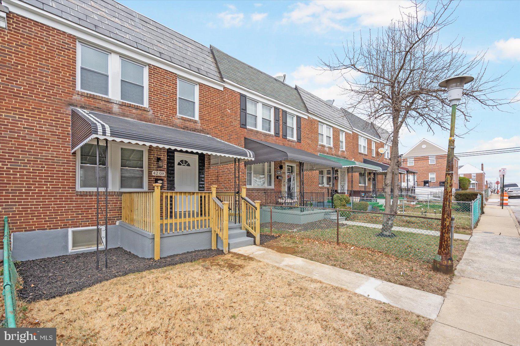 4208 Colborne Road Baltimore, MD 21229 - Photo 3 of 34 a view of a house with a yard