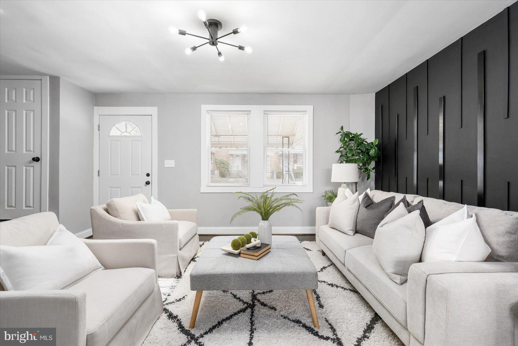 4208 Colborne Road Baltimore, MD 21229 - Photo 6 of 34 a living room with furniture and a potted plant