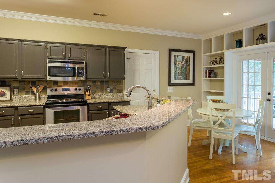 11729 Stannary Place Raleigh, NC 27613 - Photo 2 of 15 This view of the kitchen shows the breakfast area.