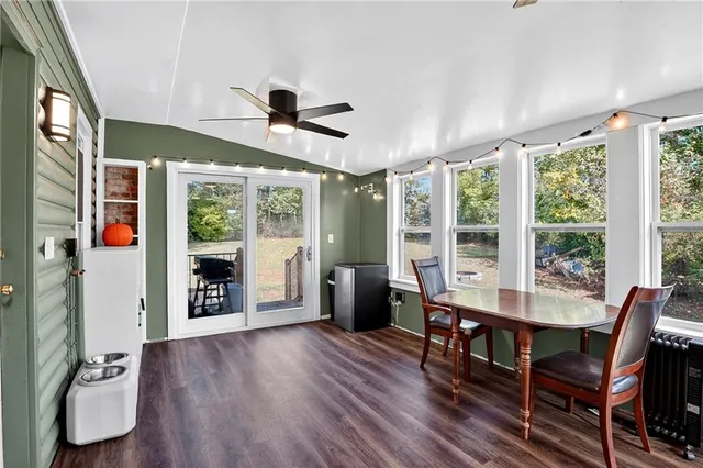 a dining room with furniture window wooden floor