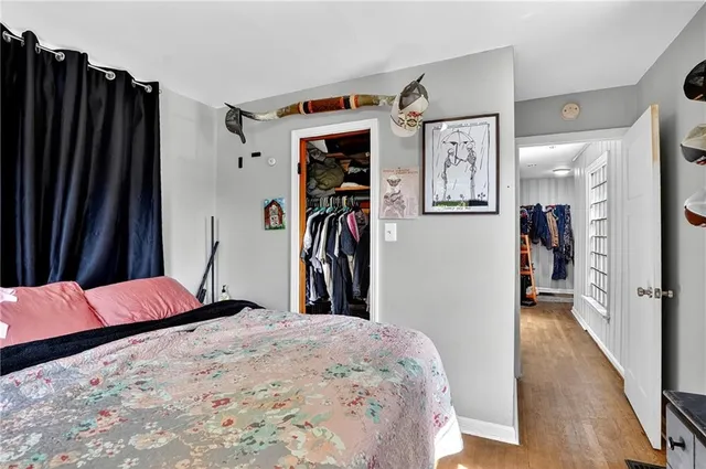 a bedroom with a bed and a closet