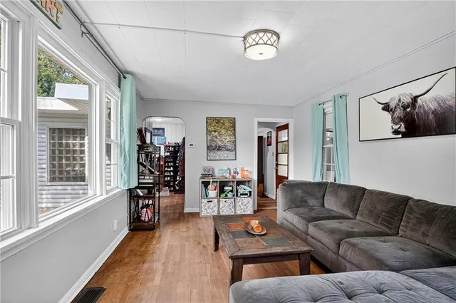 a living room with furniture and a window