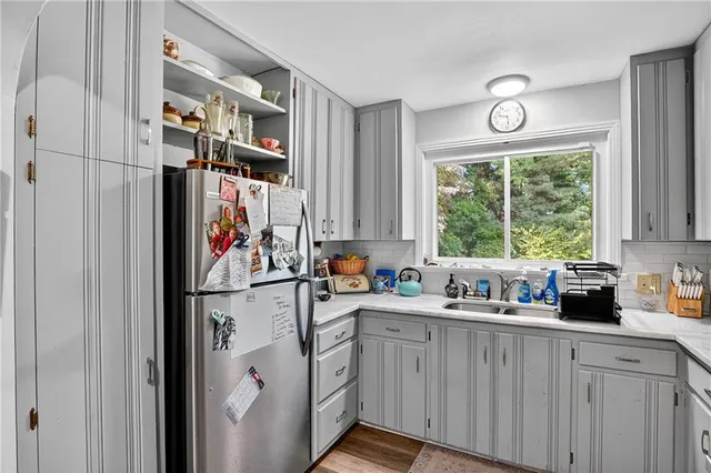 a kitchen with a sink cabinets and window