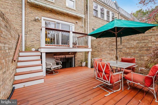 a view of a two chairs and table on the wooden floor