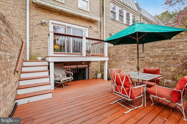 a view of a two chairs and table on the wooden floor
