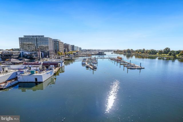a view of a lake with boats and trees
