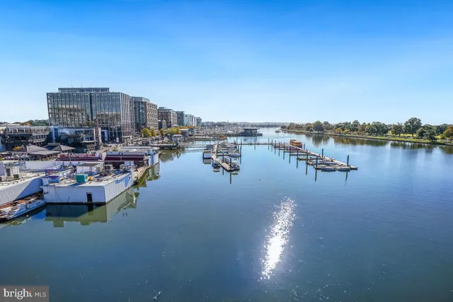 a view of a lake with boats and trees