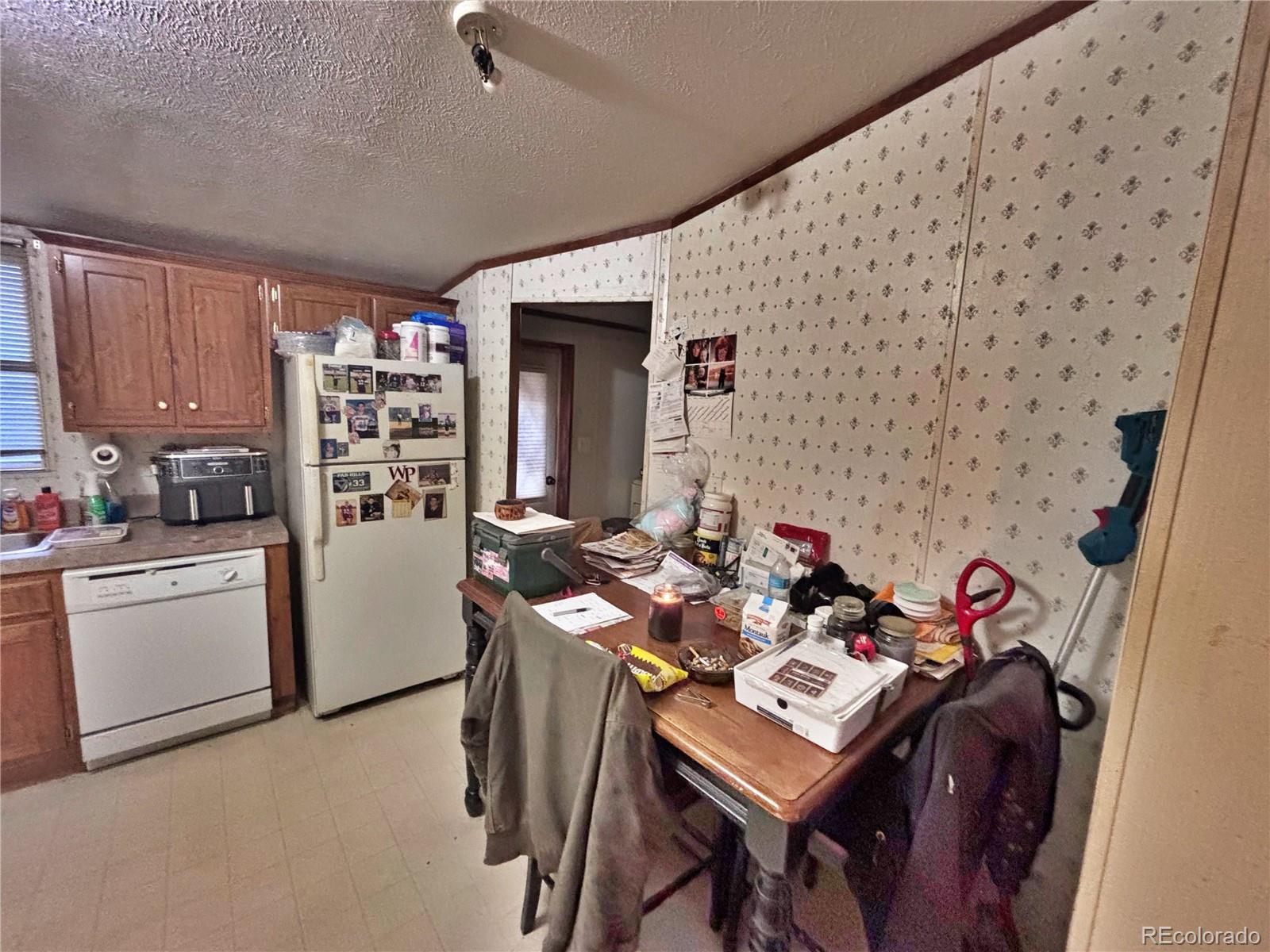 201 Pinto Street Golden, CO 80401 - Photo 17 of 22 a view of a workspace with furniture and rug