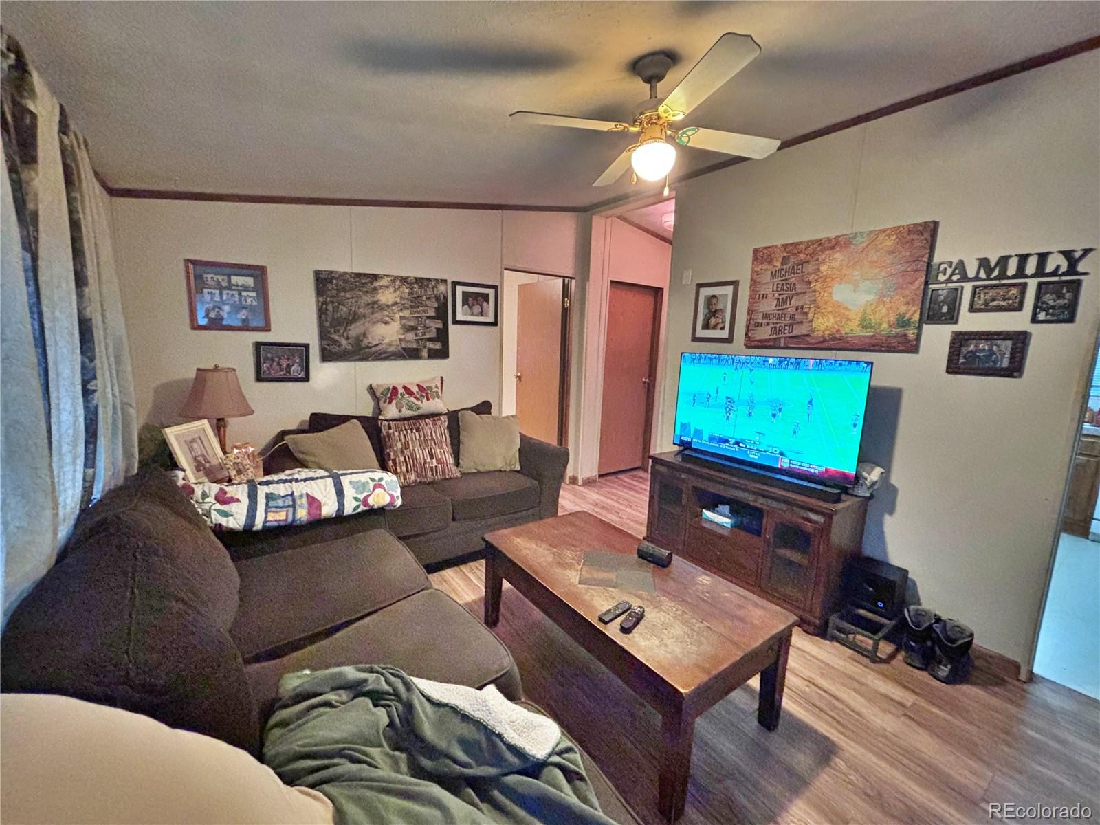201 Pinto Street Golden, CO 80401 - Photo 4 of 22 a living room with furniture and a flat screen tv