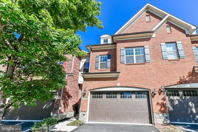 a front view of a house with a garage