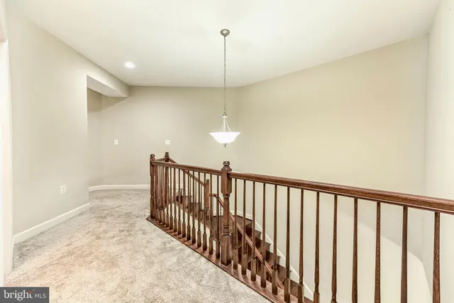 a view of a hallway with a chandelier