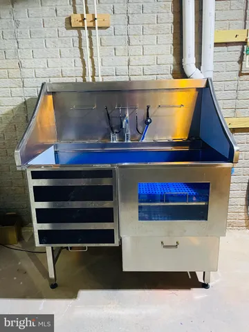 a view of table chair and wooden floor