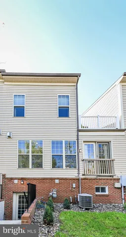 front view of a building with a yard