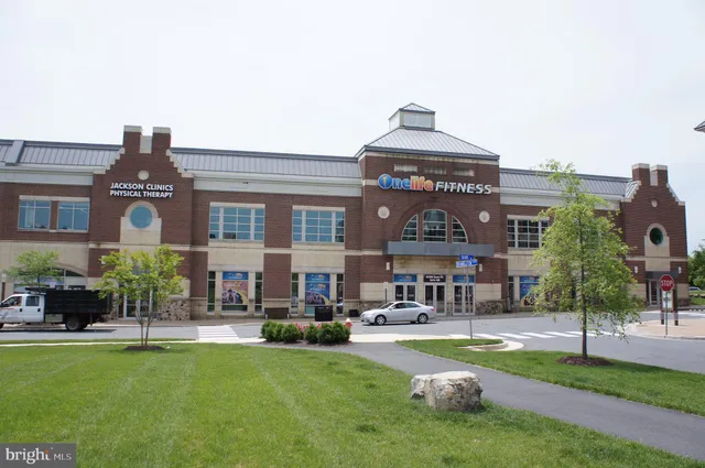 a front view of building with yard