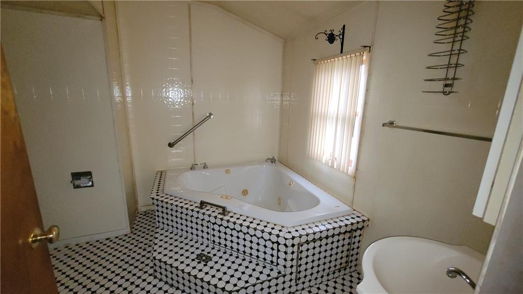 1314 George Street Coraopolis, PA 15108 - Photo 12 of 24 a bathroom with a sink a toilet and shower