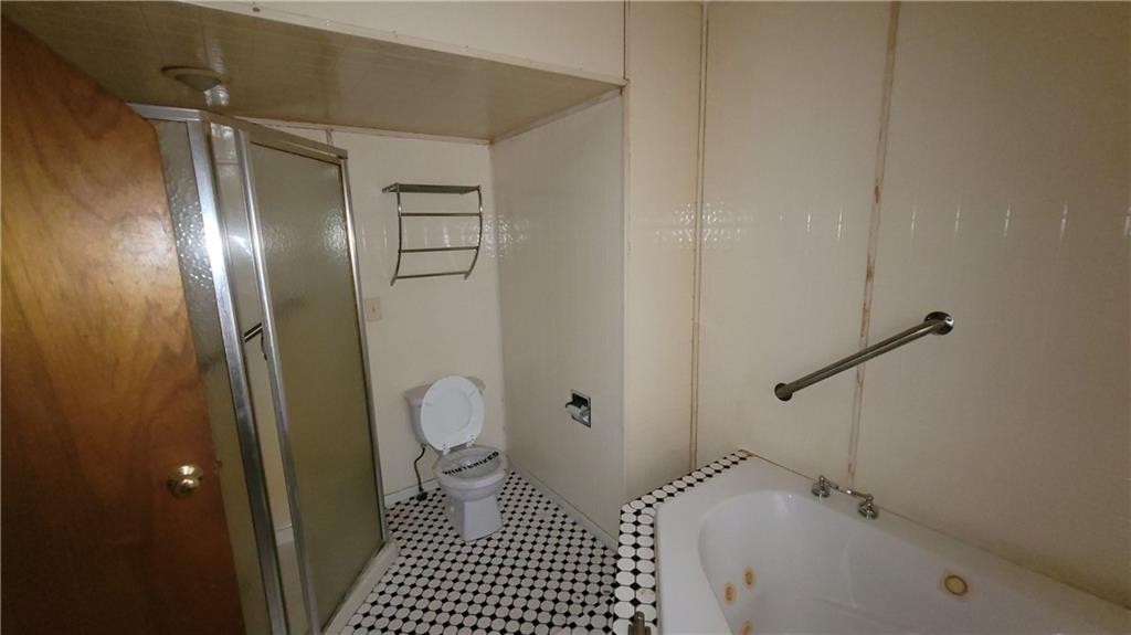 1314 George Street Coraopolis, PA 15108 - Photo 13 of 24 a bathroom with a bathtub and a shower
