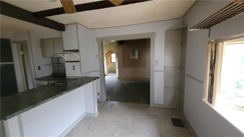 1314 George Street Coraopolis, PA 15108 - Photo 4 of 24 a kitchen with granite countertop a refrigerator and a sink