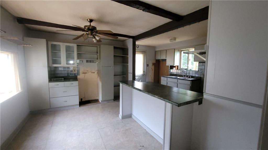 1314 George Street Coraopolis, PA 15108 - Photo 6 of 24 a kitchen with counter top space cabinets and appliances