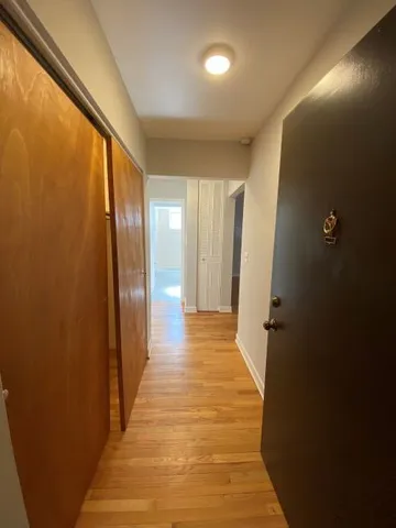 a view of gallery with wooden floor