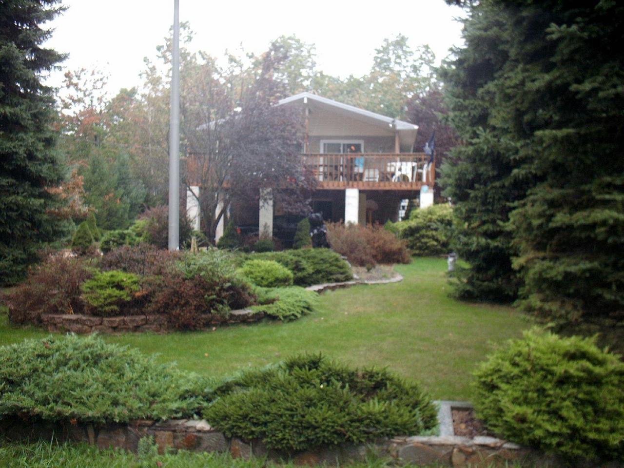 25 Crestview Road Blakeslee, PA 18610 - Photo 1 of 1 a front view of a house with a yard and shrubs