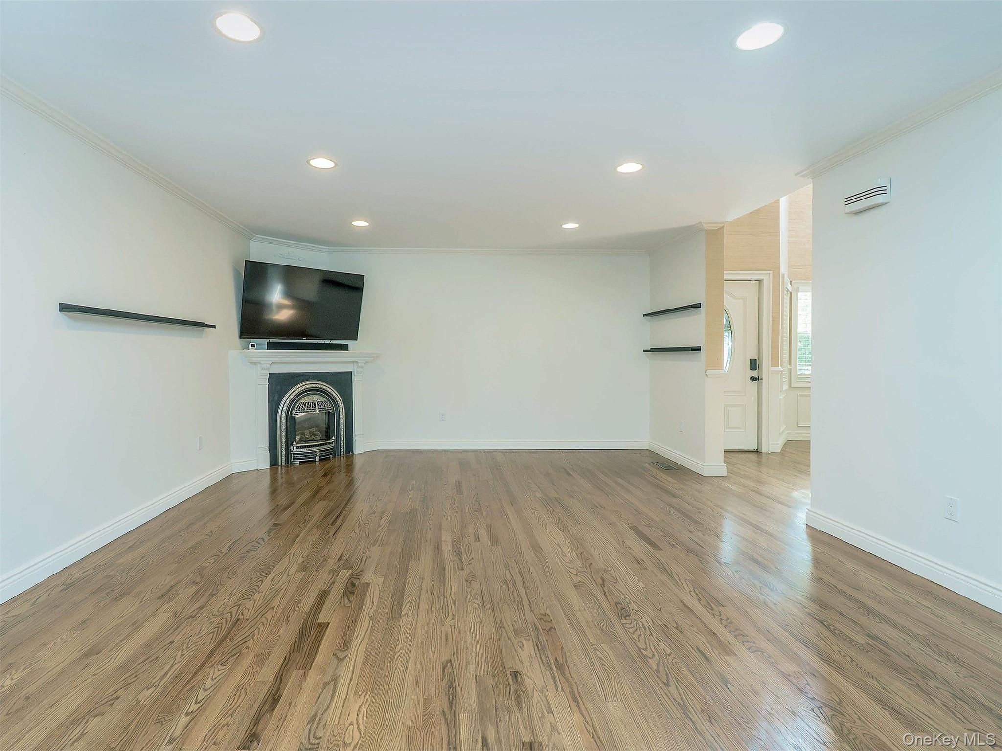 21 Marwood Road North Port Washington, NY 11050 - Photo 6 of 35 a view of empty room with wooden floor and a window
