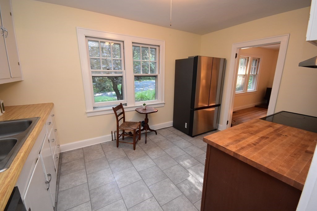 236 Harkness Road Amherst, MA 01002 - Photo 13 of 41 a kitchen with a table and chairs