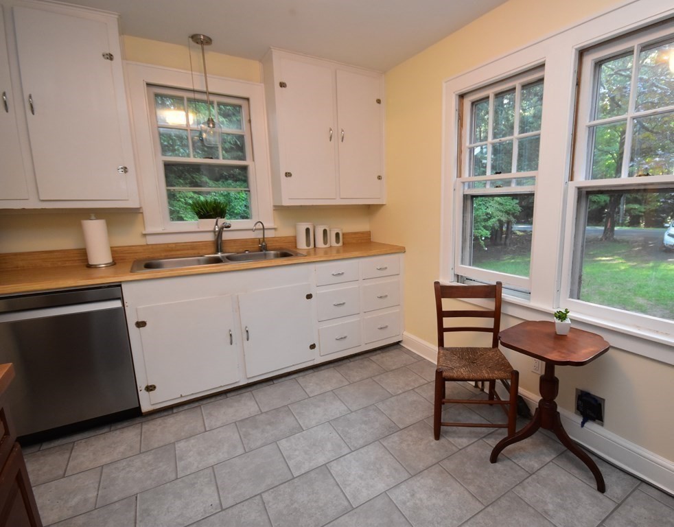 236 Harkness Road Amherst, MA 01002 - Photo 16 of 41 a kitchen that has a sink a window and chairs in it
